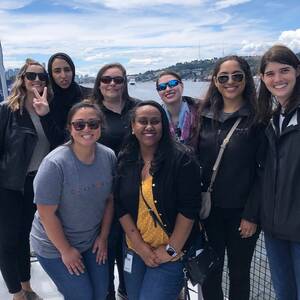 Group of coworkers outside smiling at the camera